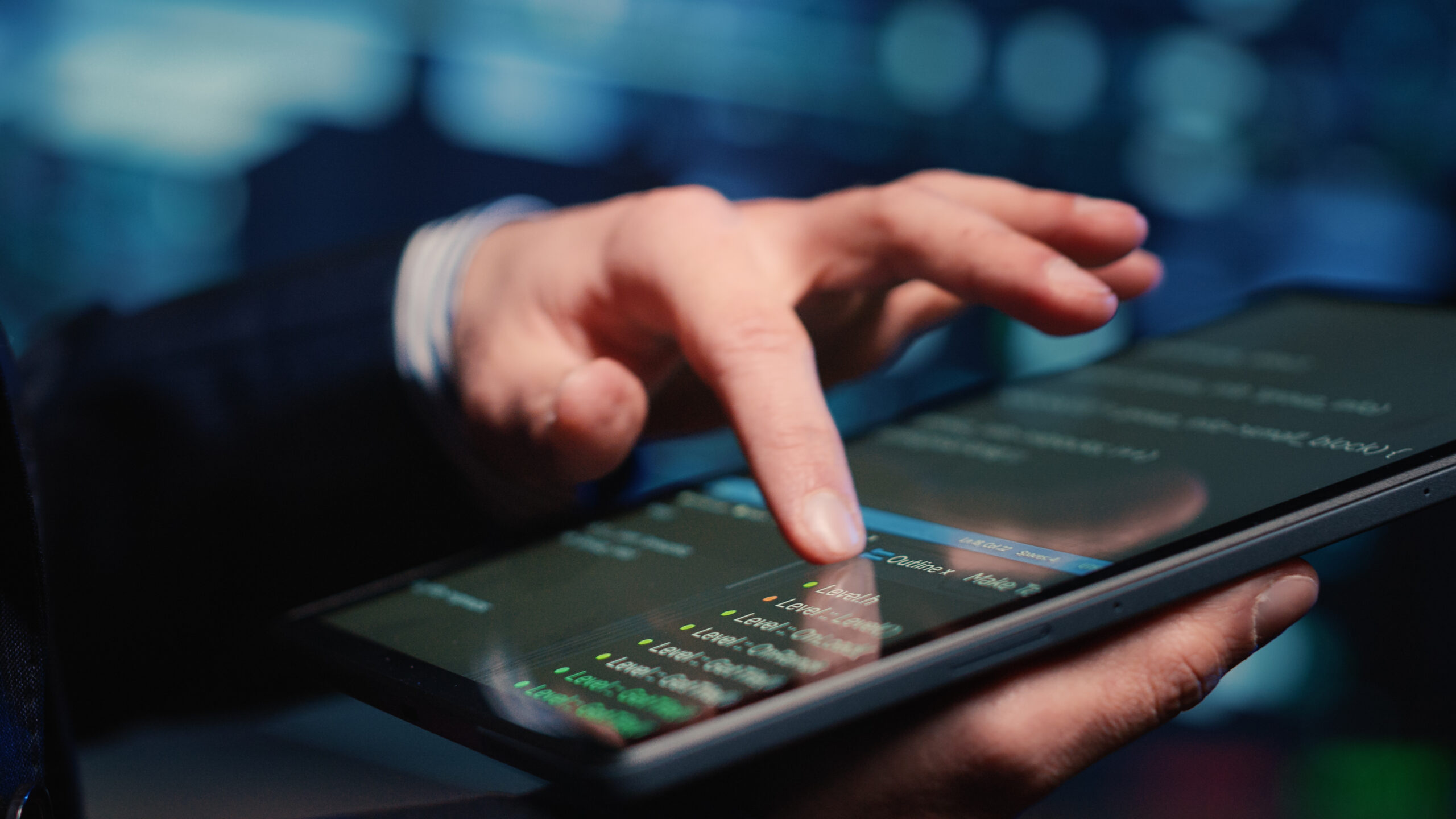 Person reviewing financial data on a tablet, representing risk assessment before investing.